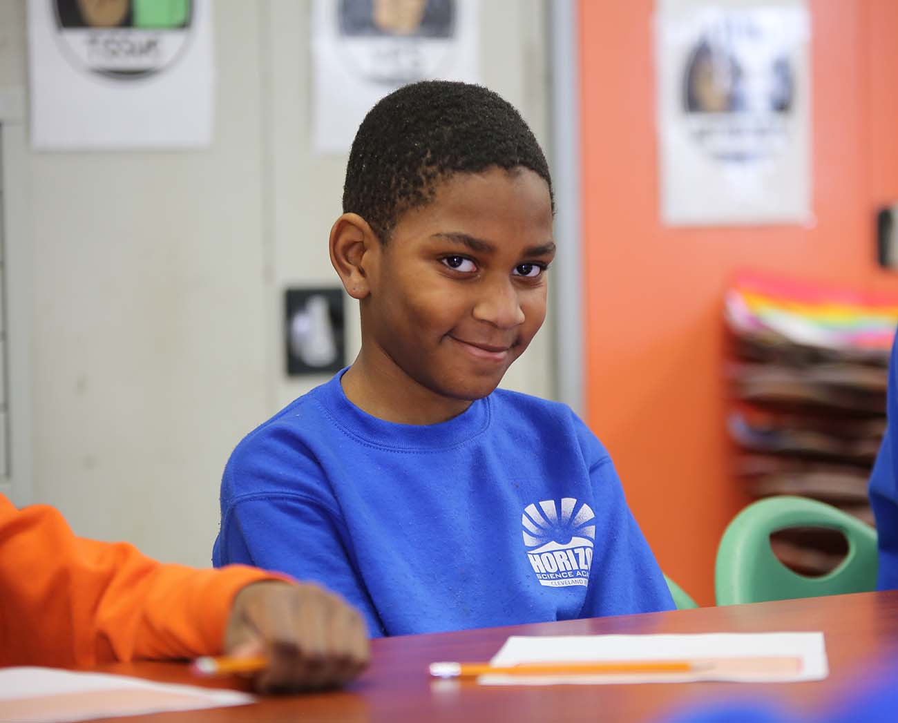 Smiling children together outdoors.